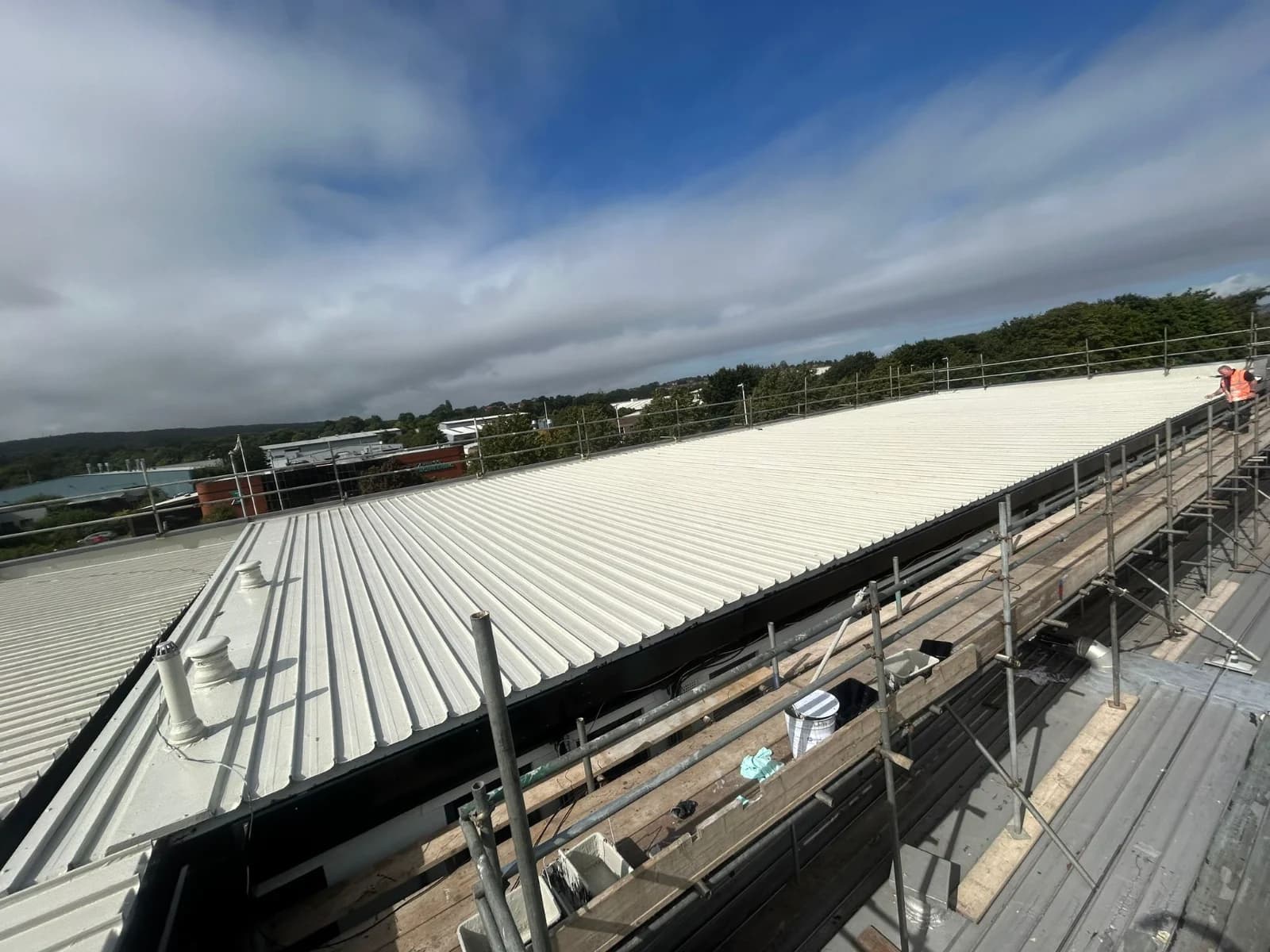 Completed standing-seam metal roof on a commercial building in the North East